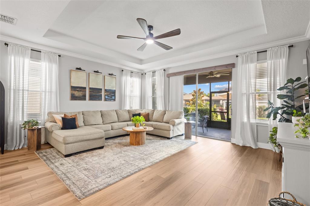 4465 Tubular Run Land O Lakes, FL 34638 - Photo 23 of 60 a living room with furniture and wooden floor