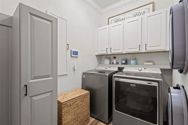 a bedroom with a bed and a ceiling fan