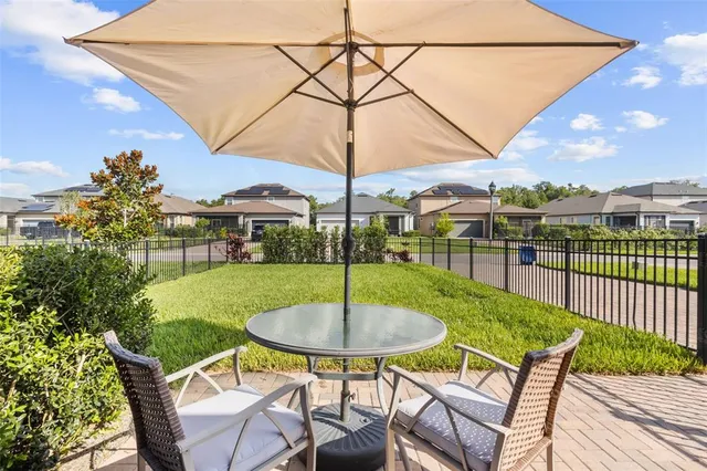 a view of walk in closet with clothes