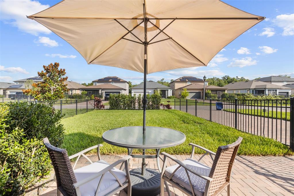 4465 Tubular Run Land O Lakes, FL 34638 - Photo 27 of 60 a patio with a table and chairs