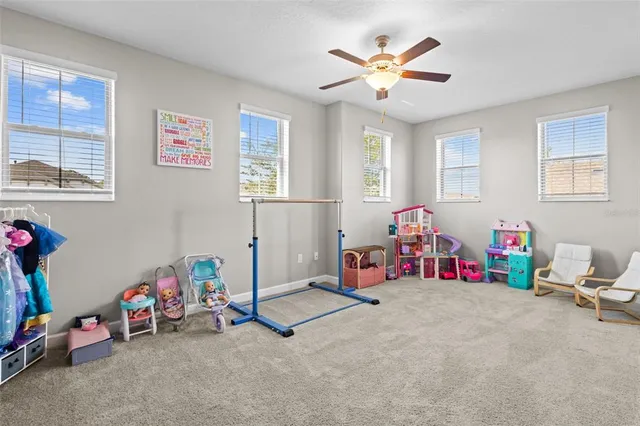 a bathroom with a shower curtain and a window