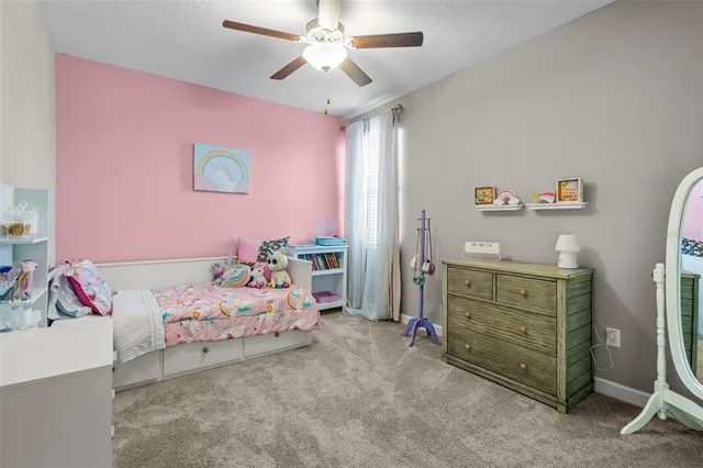 a en suite bathroom with a granite countertop sink and a mirror