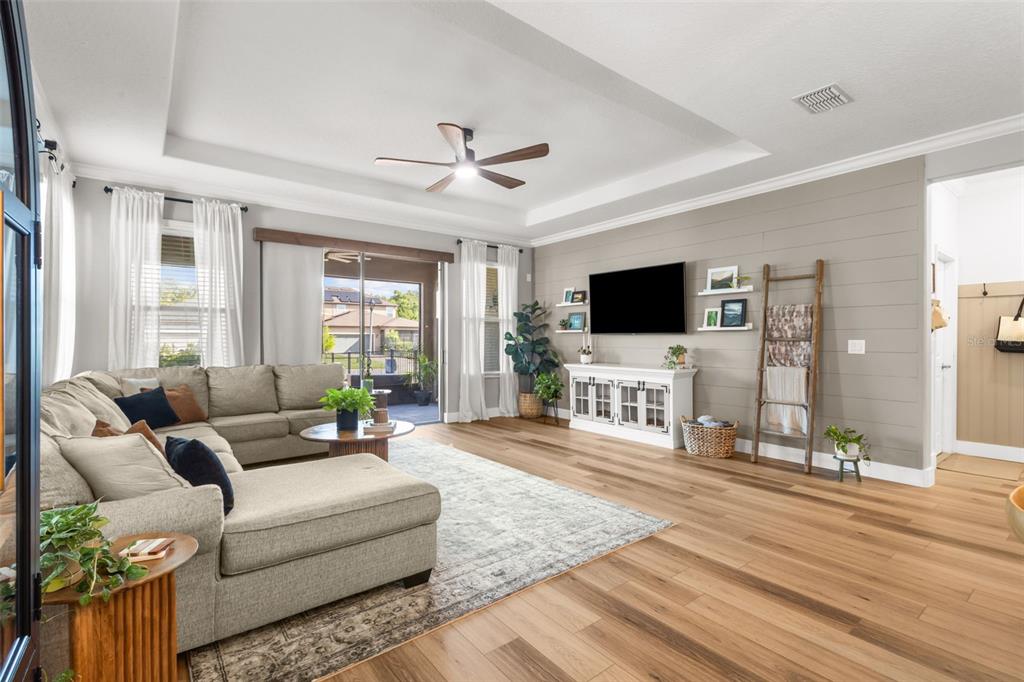4465 Tubular Run Land O Lakes, FL 34638 - Photo 3 of 60 a living room with furniture and a flat screen tv