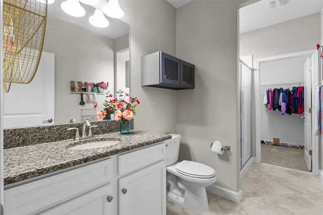 a bathroom with a sink double vanity and a mirror