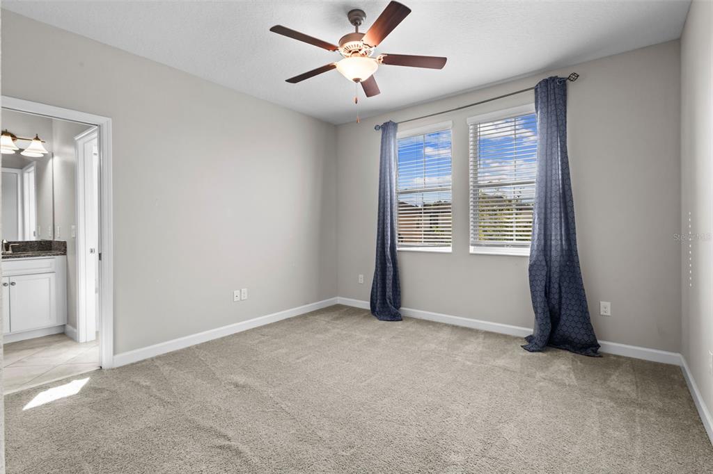 4465 Tubular Run Land O Lakes, FL 34638 - Photo 33 of 60 an empty room with windows and fan