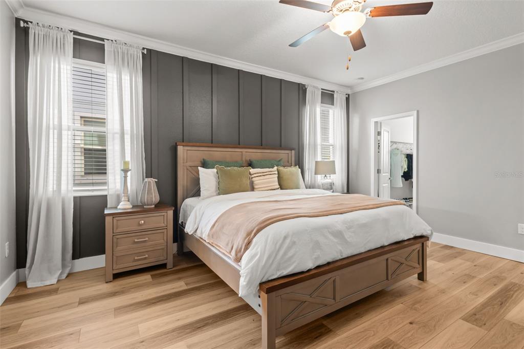 4465 Tubular Run Land O Lakes, FL 34638 - Photo 4 of 60 a bedroom with a bed and a chandelier