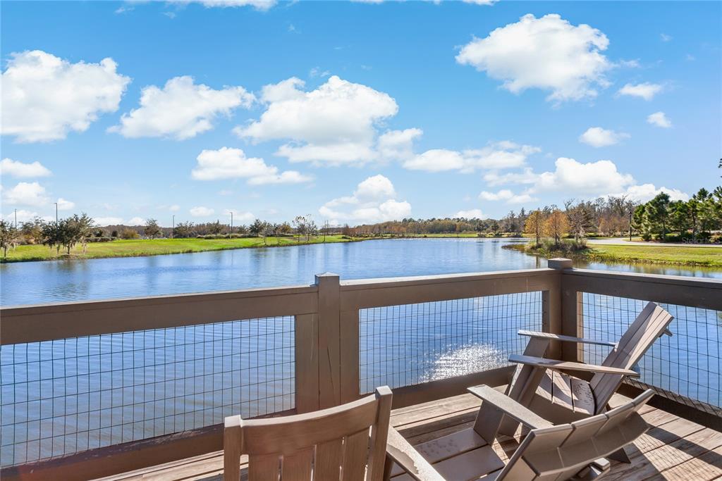 4465 Tubular Run Land O Lakes, FL 34638 - Photo 46 of 60 a view of a terrace with lawn chairs and wooden floor