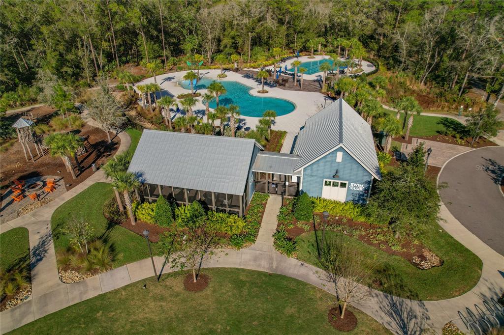 4465 Tubular Run Land O Lakes, FL 34638 - Photo 48 of 60 an aerial view of a house with swimming pool outdoor seating and yard