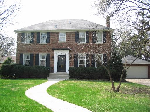 189 Southcote Road Riverside, IL 60546 - Photo 1 of 1 a view of a brick house with a yard potted plants and a large tree