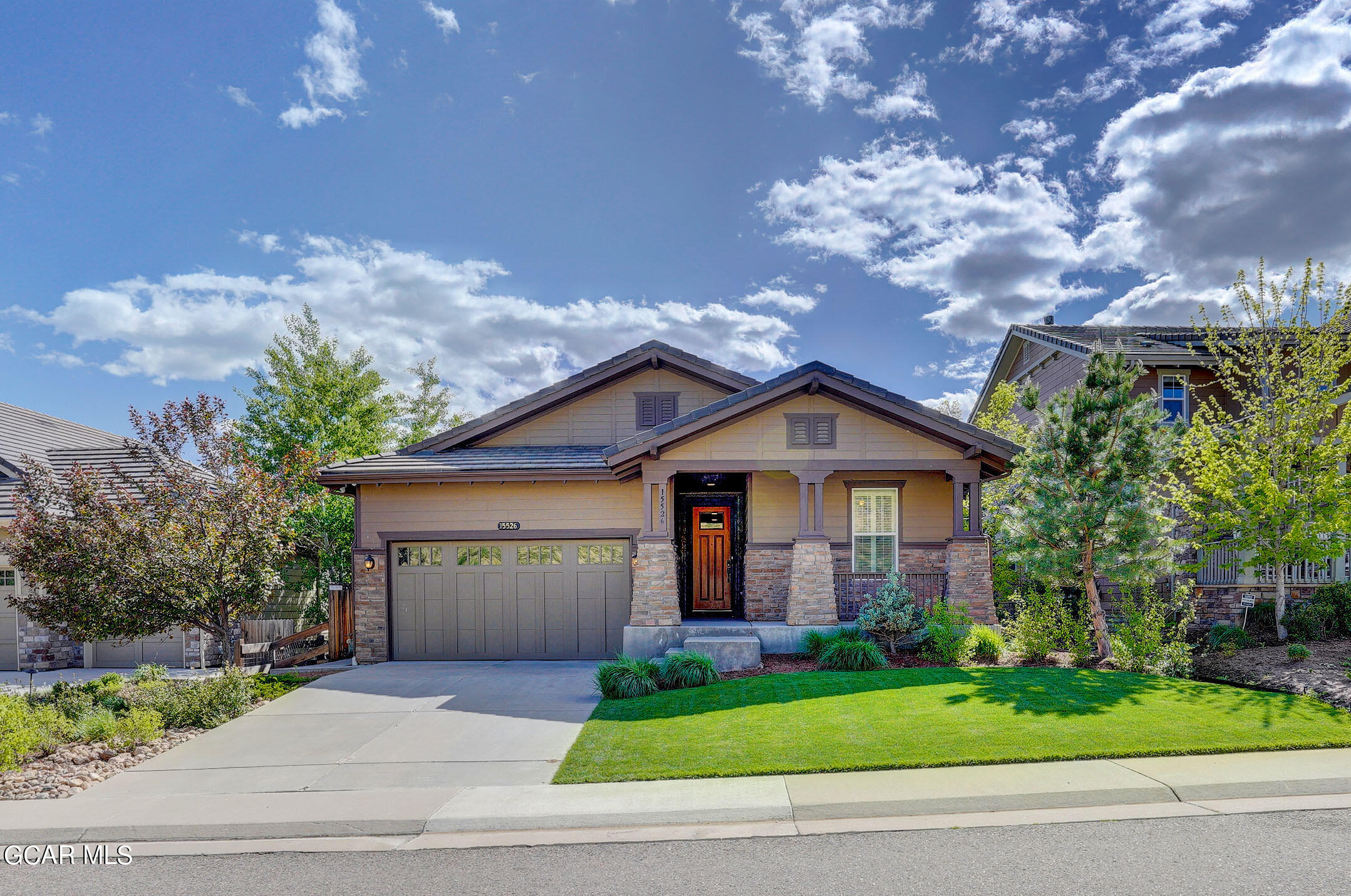 15526 Red Deer Drive Morrison, CO 80465 - Photo 11 of 82 a front view of a house with a yard and garage