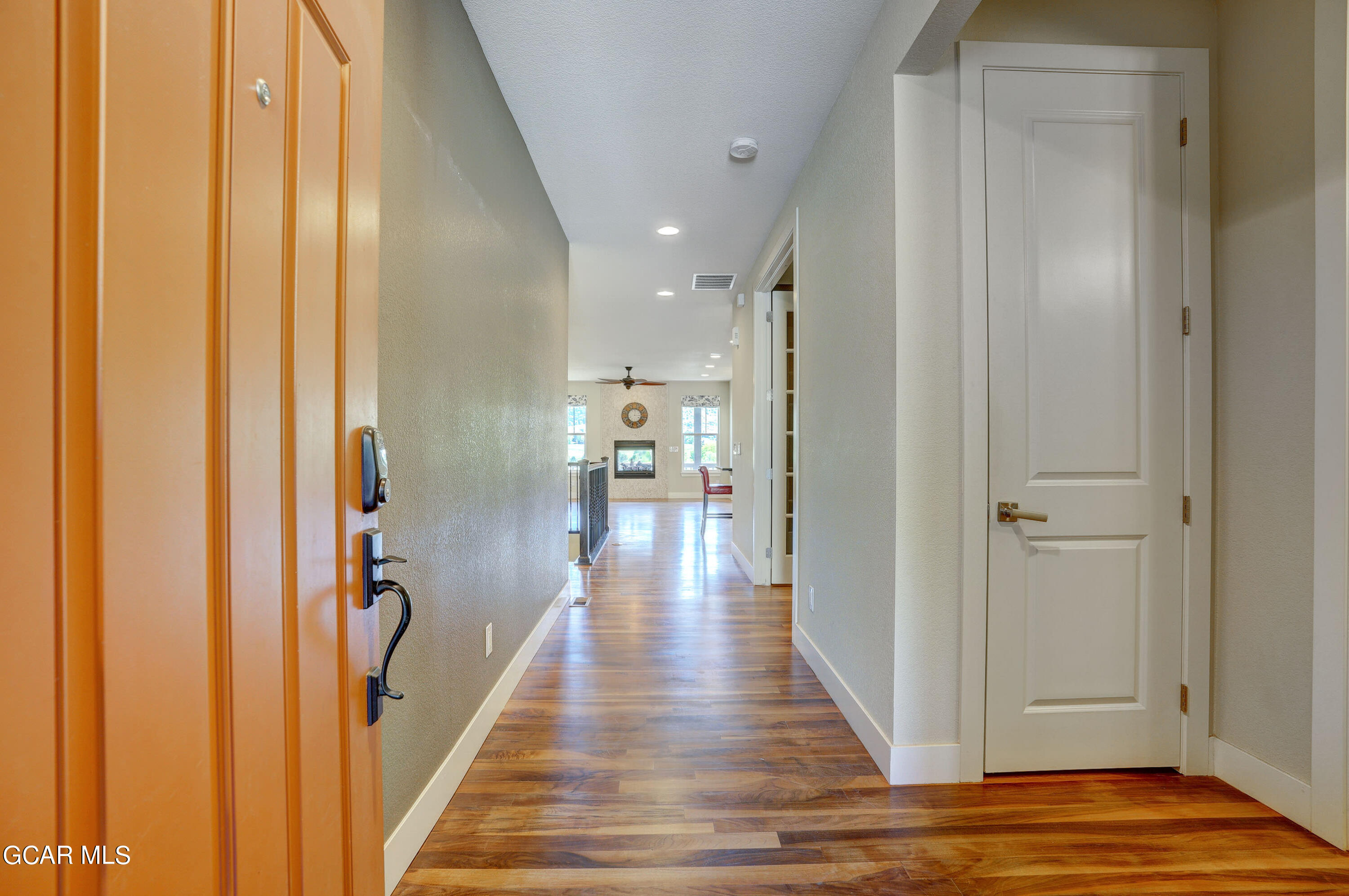 15526 Red Deer Drive Morrison, CO 80465 - Photo 13 of 82 a view of a hallway with wooden floor and staircase