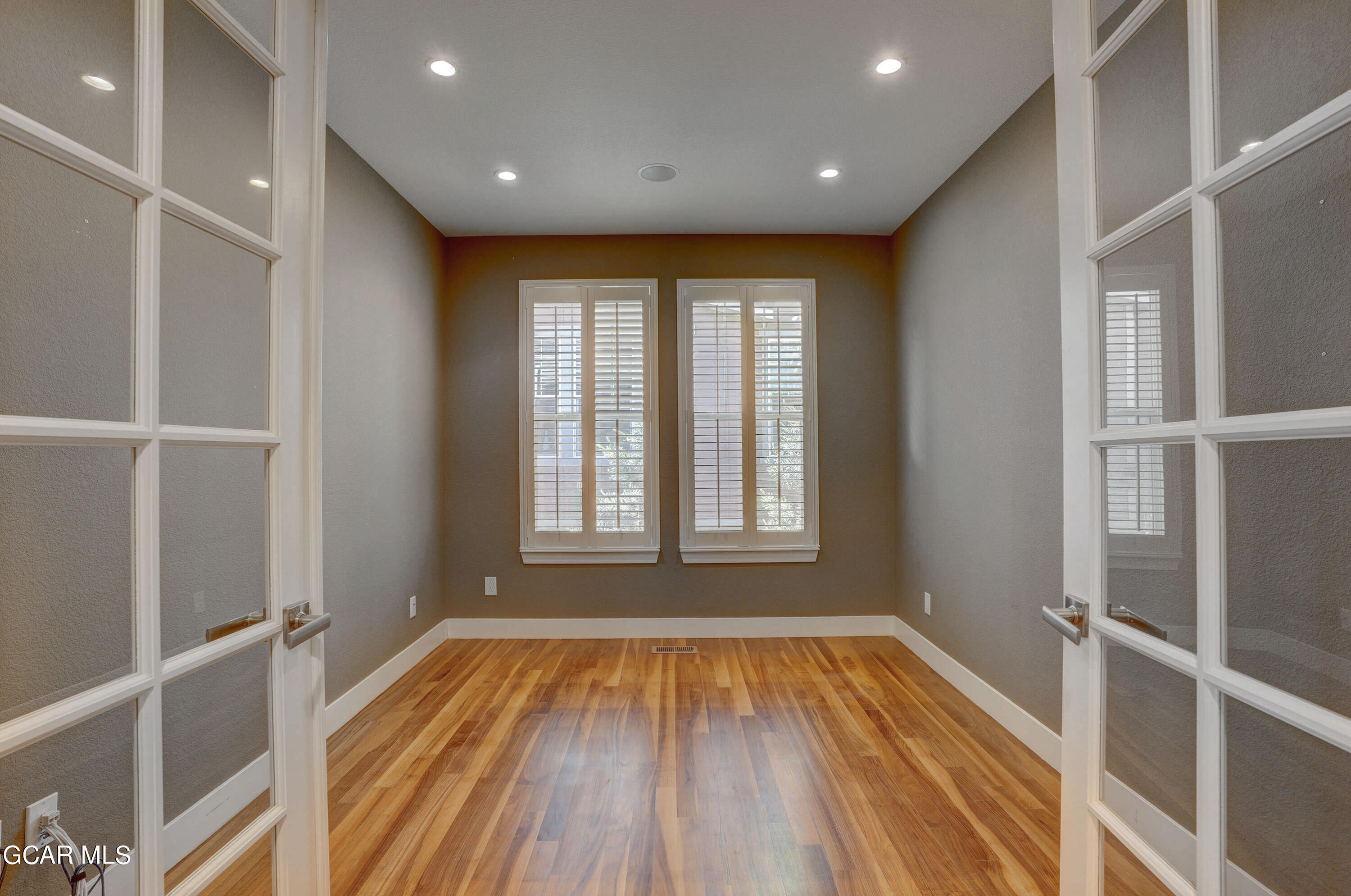 15526 Red Deer Drive Morrison, CO 80465 - Photo 18 of 82 a view of an empty room with wooden floor and a window