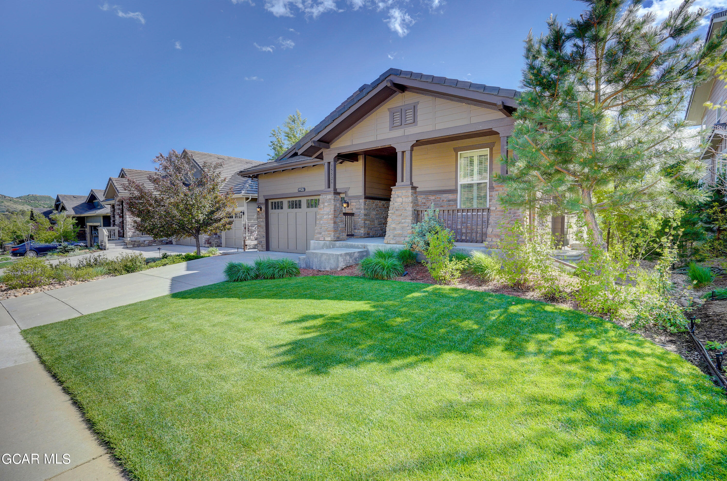 15526 Red Deer Drive Morrison, CO 80465 - Photo 2 of 82 a front view of house with yard and green space