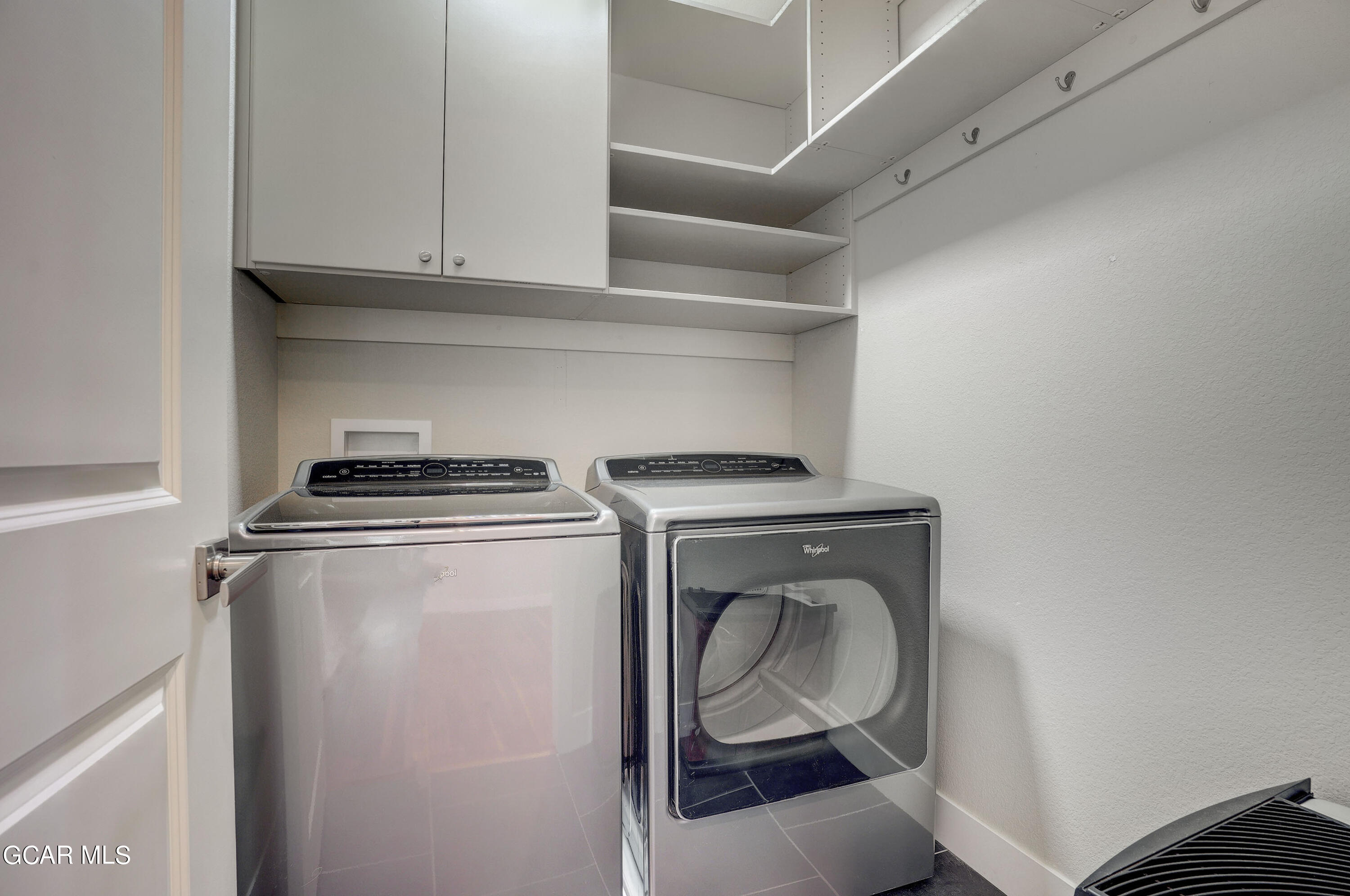 15526 Red Deer Drive Morrison, CO 80465 - Photo 21 of 82 a utility room with dryer and washer
