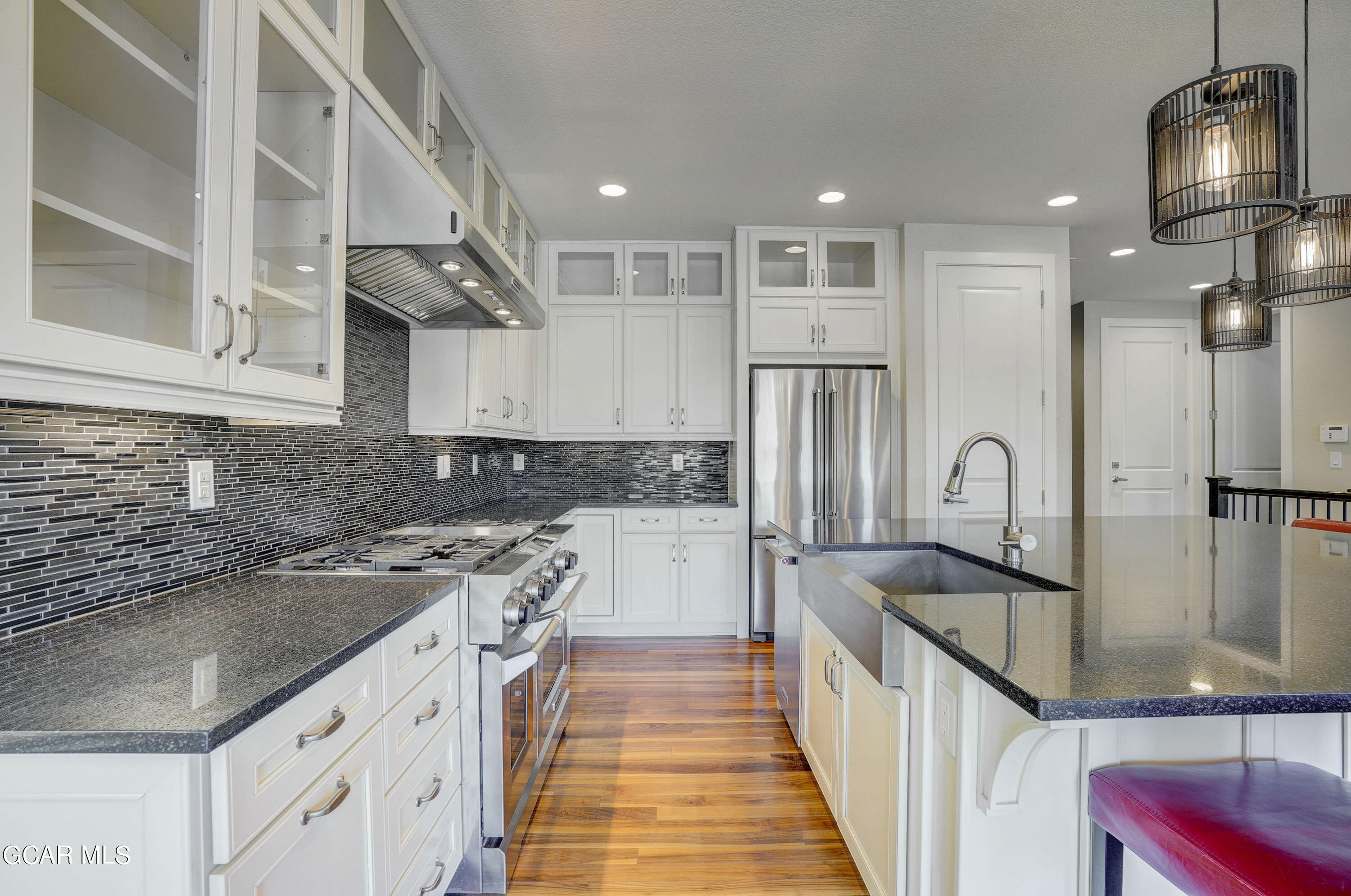 15526 Red Deer Drive Morrison, CO 80465 - Photo 24 of 82 a kitchen with stainless steel appliances granite countertop a sink stove and refrigerator