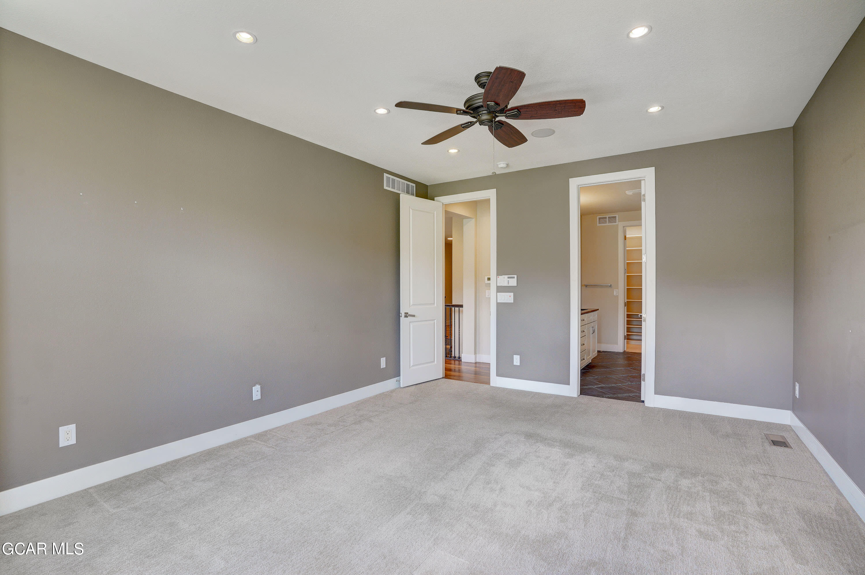 15526 Red Deer Drive Morrison, CO 80465 - Photo 32 of 82 a view of a livingroom with a ceiling fan & windows