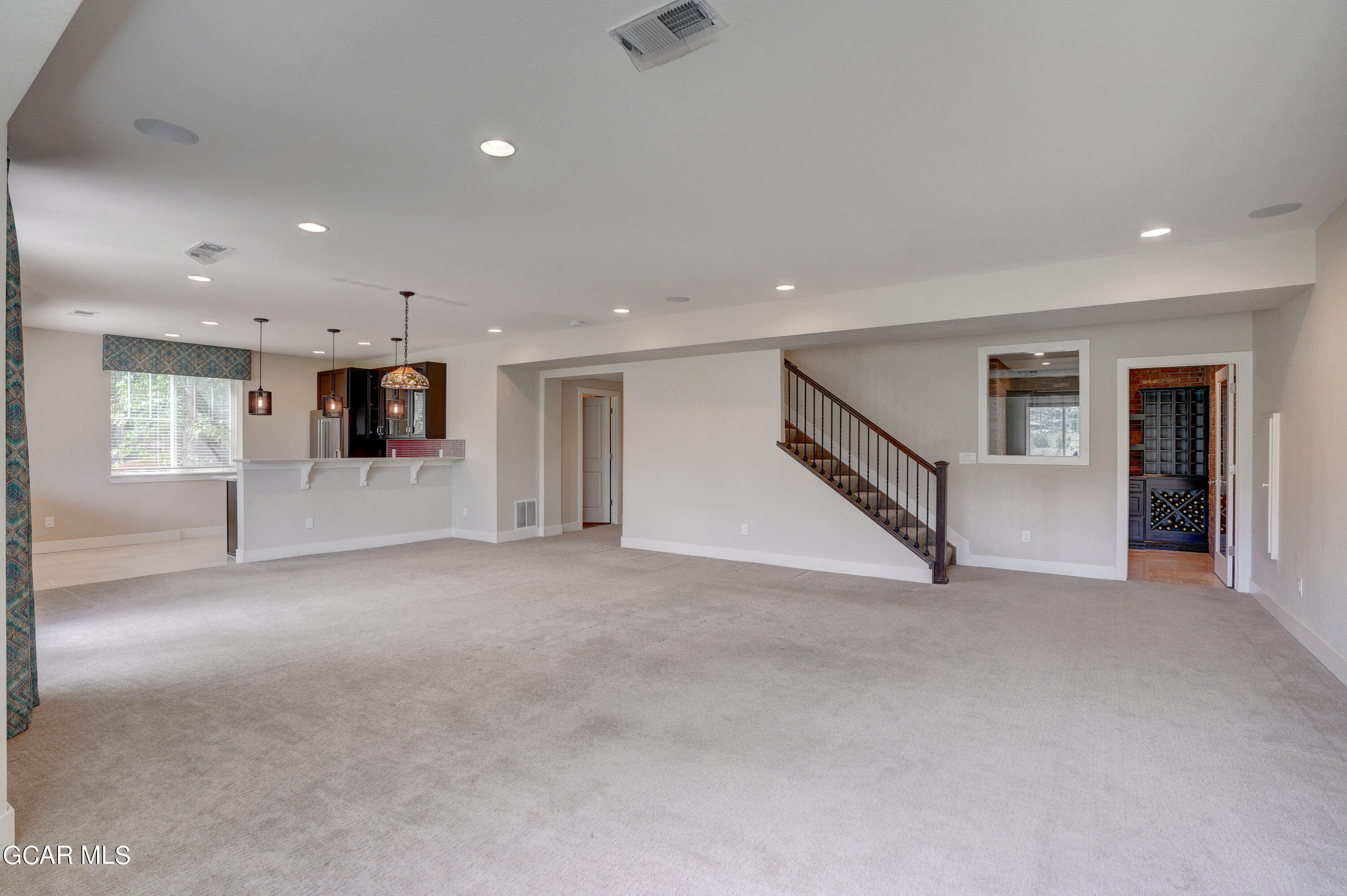 15526 Red Deer Drive Morrison, CO 80465 - Photo 39 of 82 an empty room with white walls and stairs