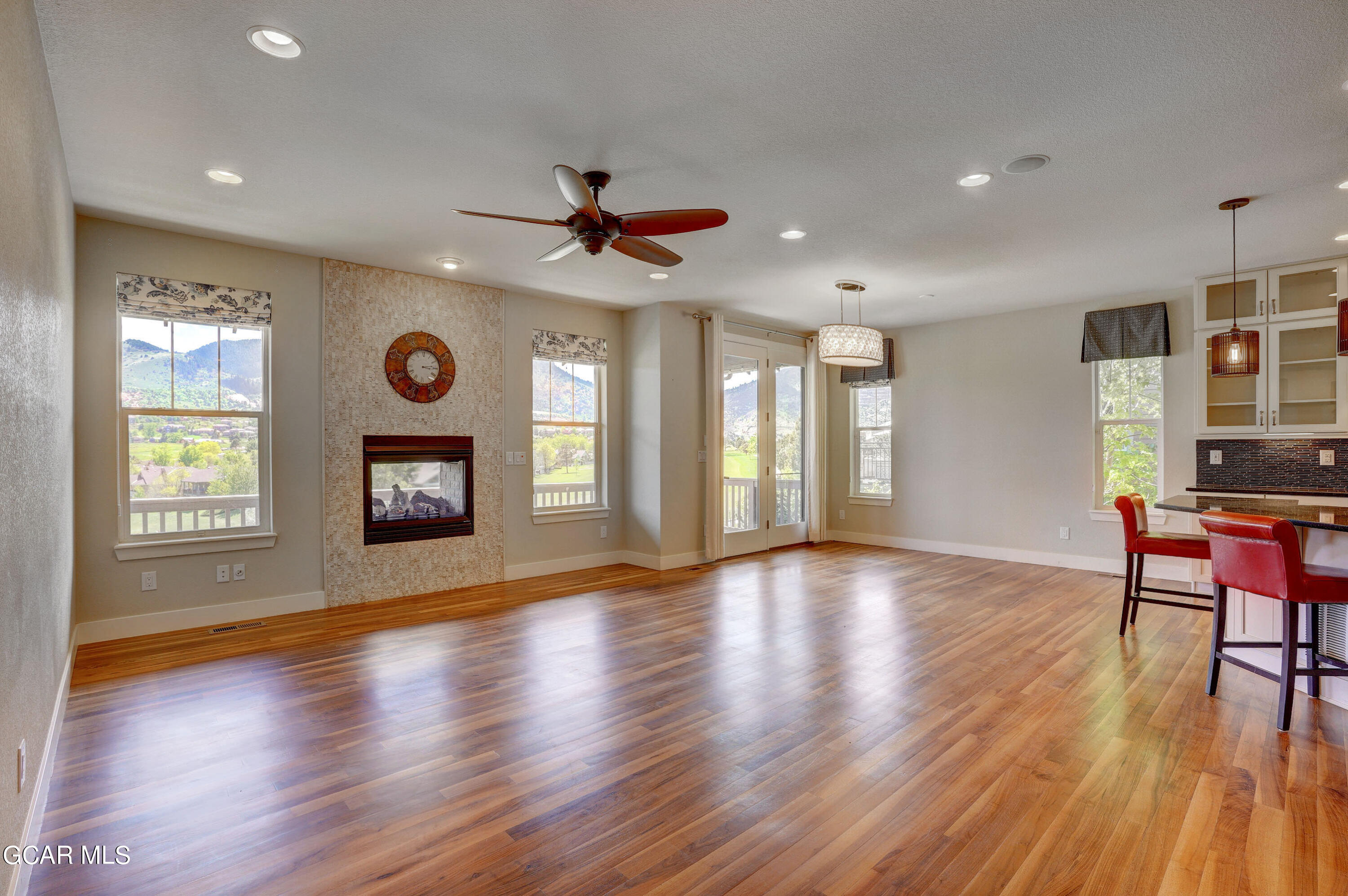 15526 Red Deer Drive Morrison, CO 80465 - Photo 4 of 82 a view of an empty room with window and wooden floor