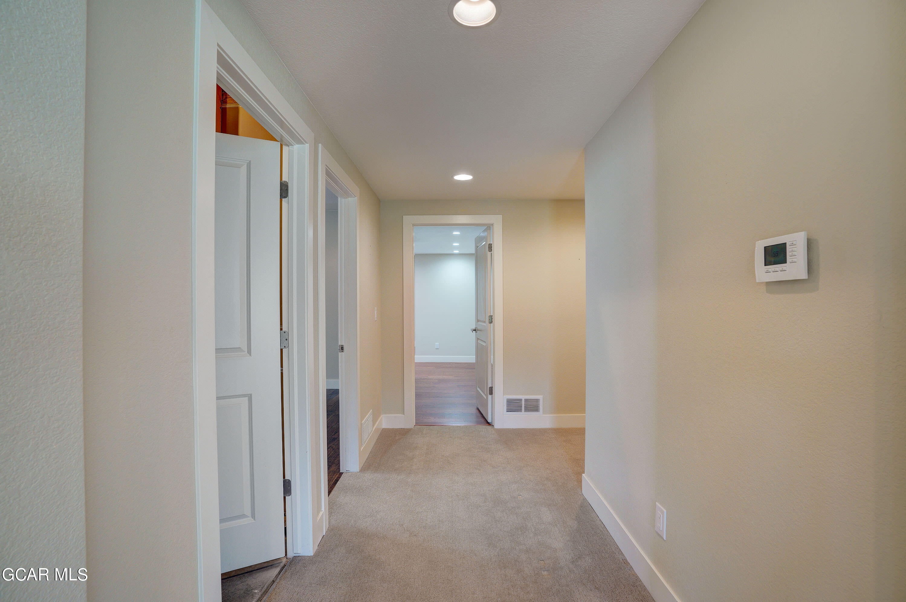 15526 Red Deer Drive Morrison, CO 80465 - Photo 44 of 82 a view of a hallway with wooden shelves