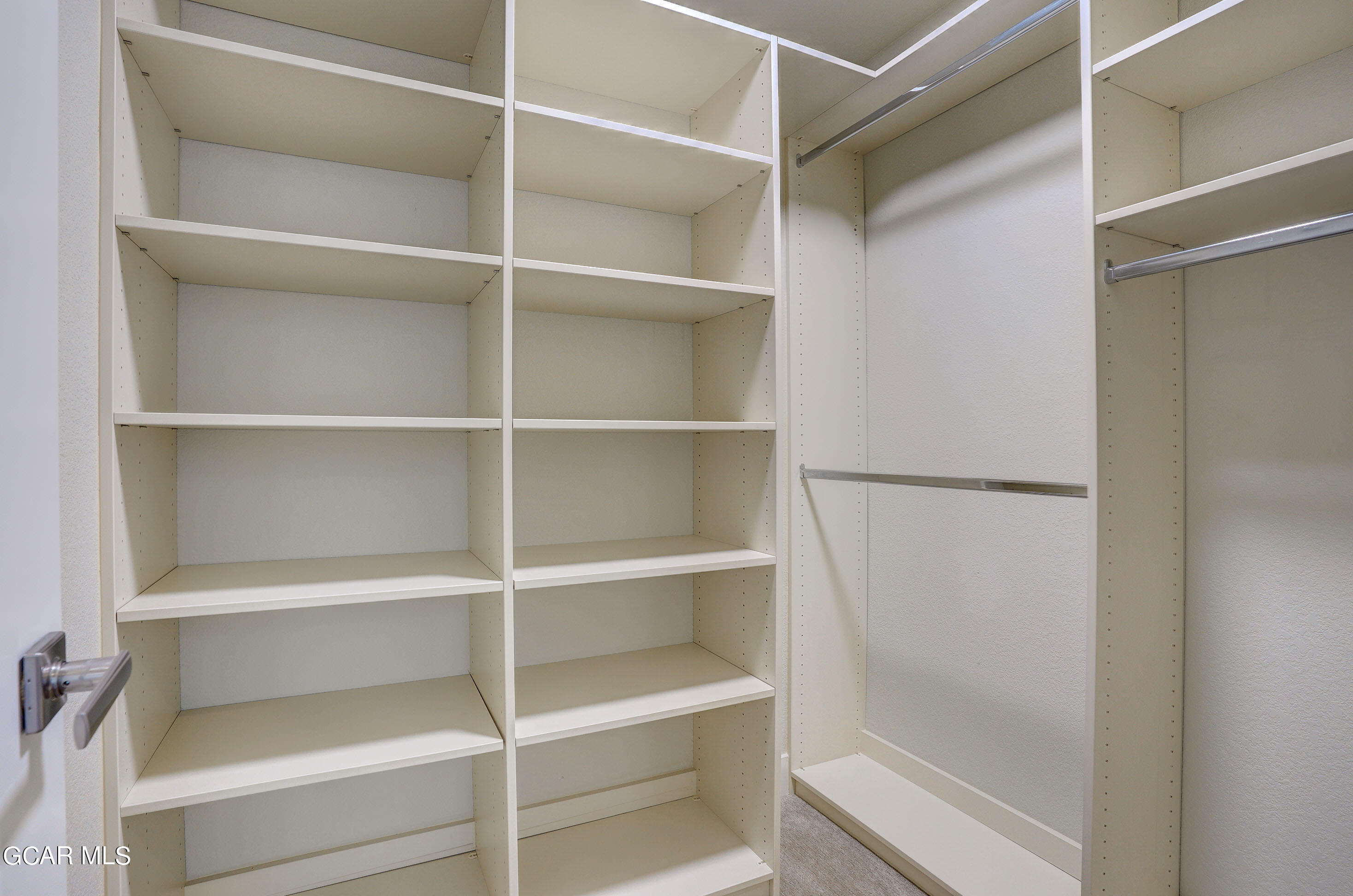 15526 Red Deer Drive Morrison, CO 80465 - Photo 48 of 82 a view of walk in closet with empty racks