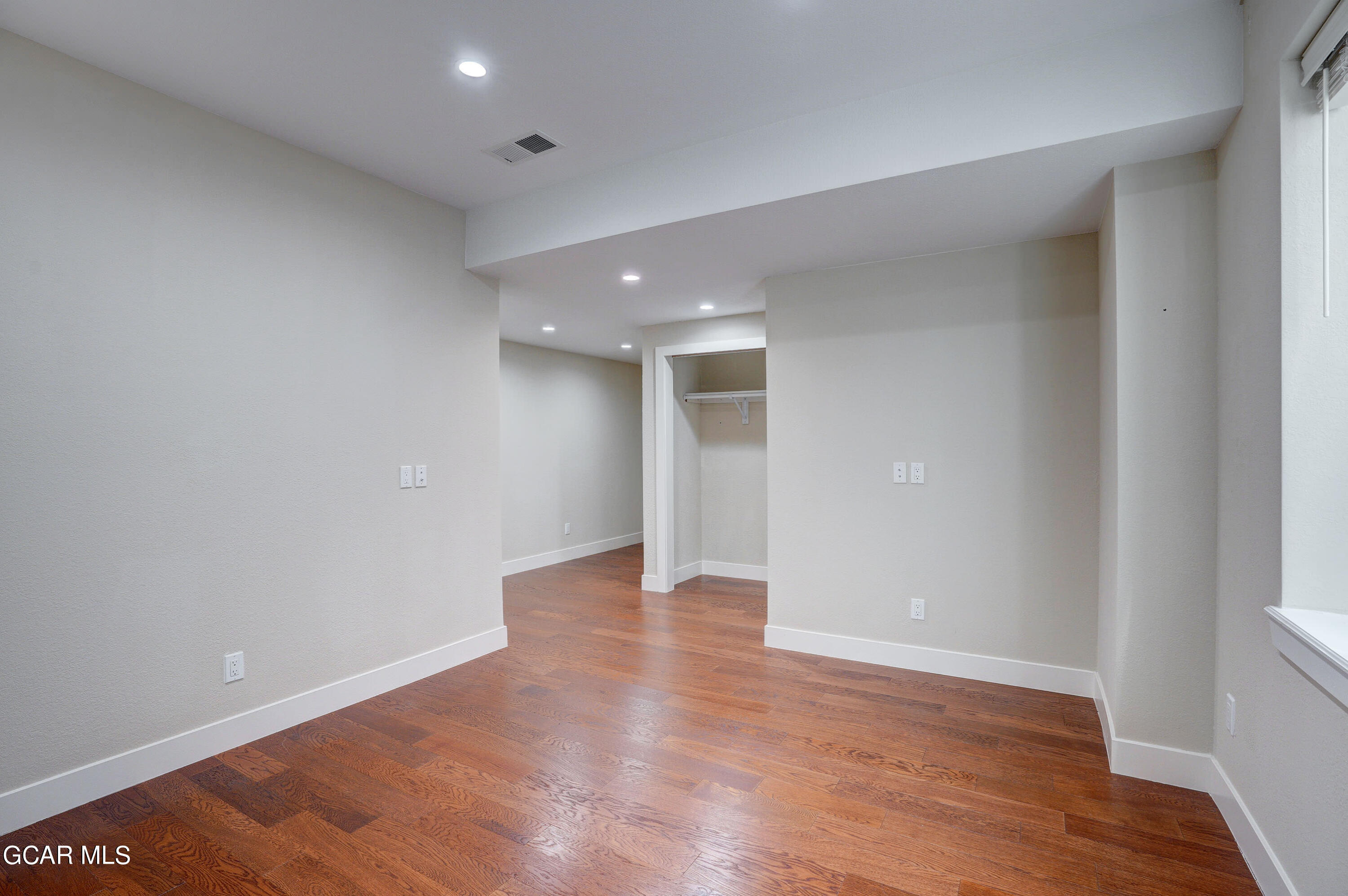 15526 Red Deer Drive Morrison, CO 80465 - Photo 51 of 82 a view of an empty room with wooden floor