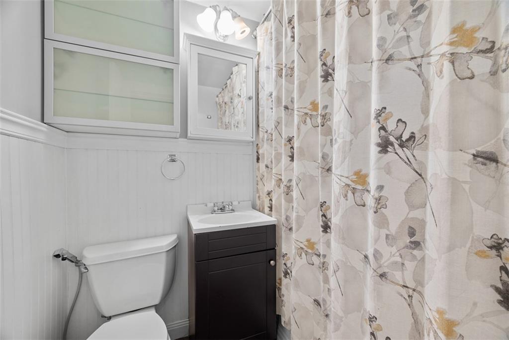 1534 McFarland Road Pittsburgh, PA 15216 - Photo 16 of 36 a white toilet sitting next to a bathroom sink