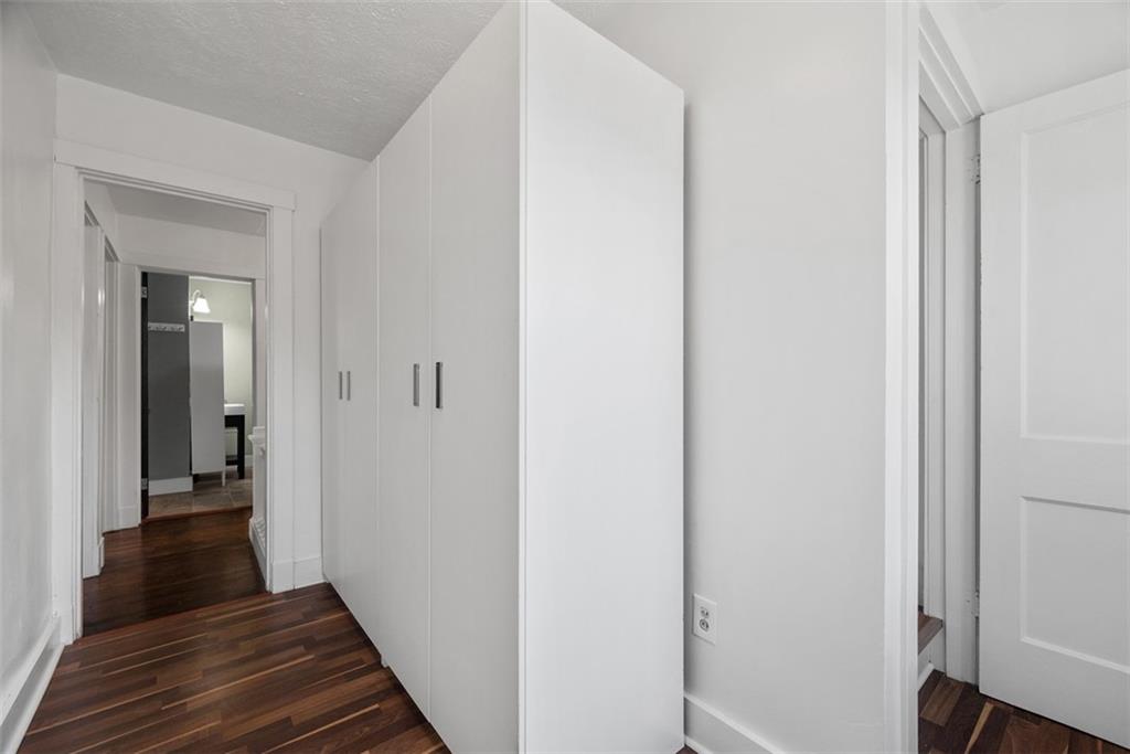 1534 McFarland Road Pittsburgh, PA 15216 - Photo 23 of 36 a view of a hallway with wooden floor