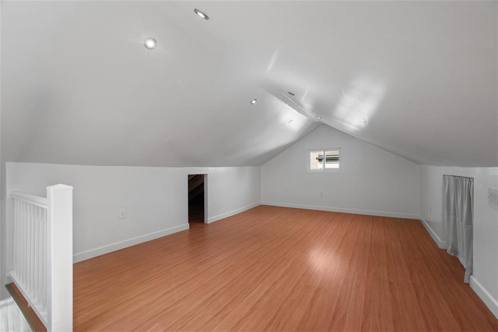 1534 McFarland Road Pittsburgh, PA 15216 - Photo 24 of 36 wooden floor in an empty room with a window