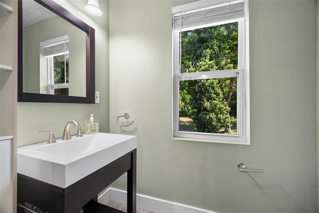 1534 McFarland Road Pittsburgh, PA 15216 - Photo 28 of 36 a bathroom with a sink and a mirror