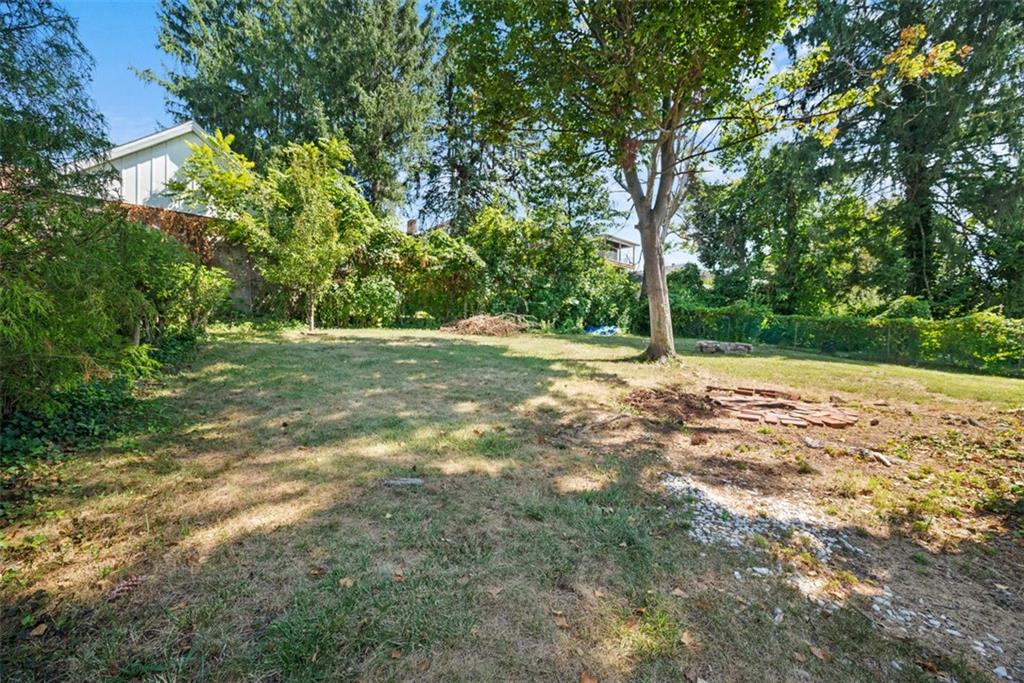 1534 McFarland Road Pittsburgh, PA 15216 - Photo 31 of 36 a view of a yard with a tree