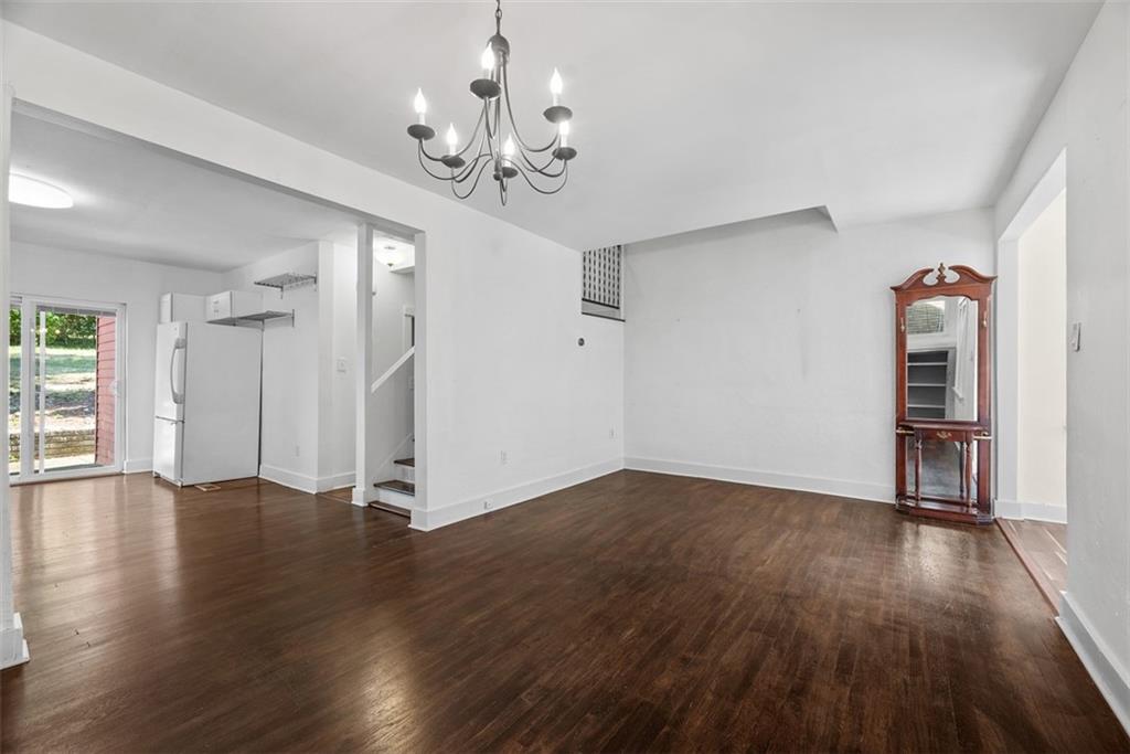 1534 McFarland Road Pittsburgh, PA 15216 - Photo 7 of 36 a view of empty room with wooden floor and window