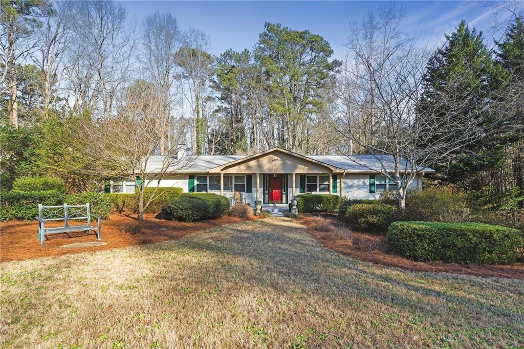 1638 Folkstone Road Northeast Brookhaven, GA 30329 - Photo 1 of 1 a view of a house with backyard and sitting area