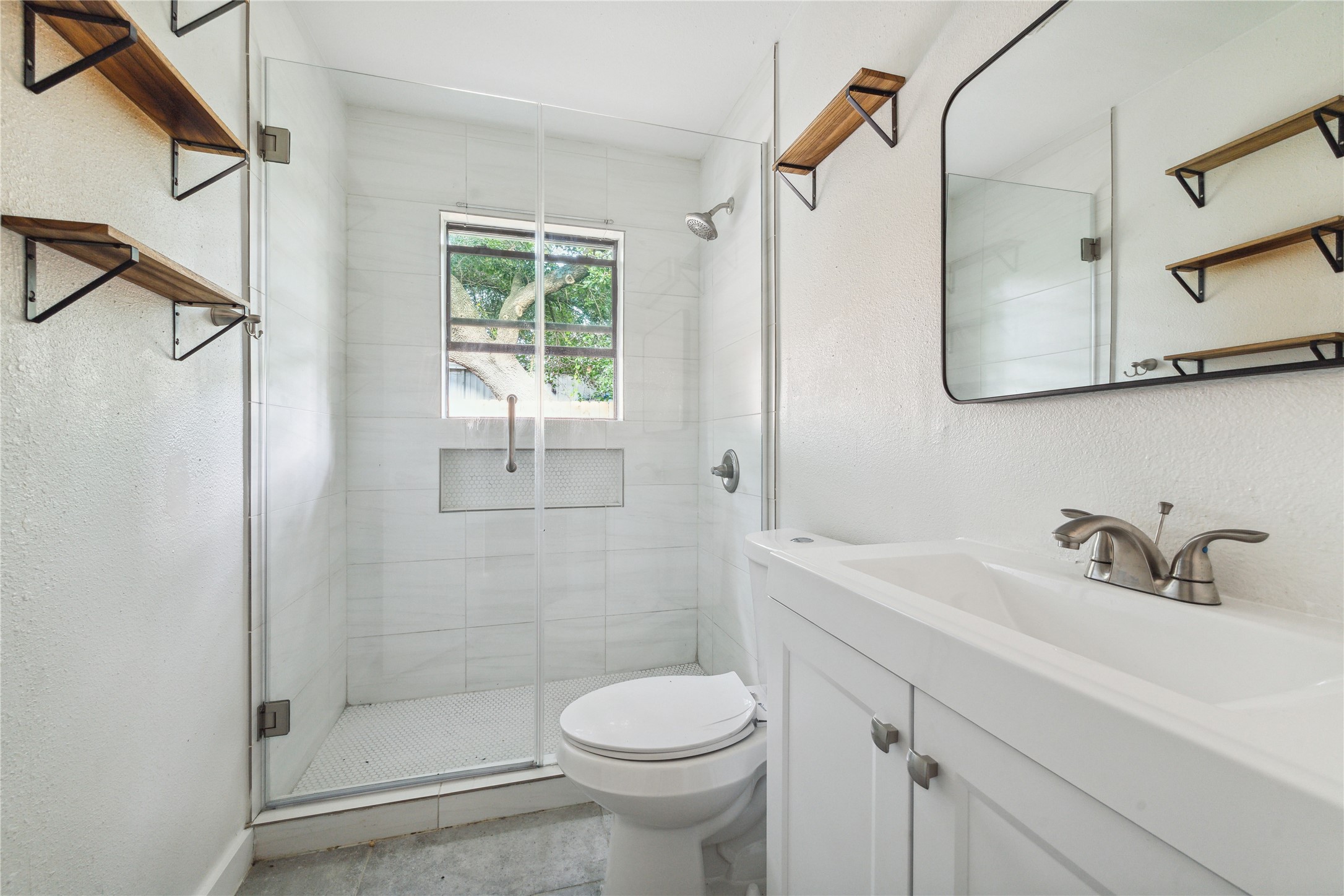 4210 Delhi Street, Unit 1/2 Houston, TX 77022 - Photo 8 of 8 a bathroom with a sink toilet and shower