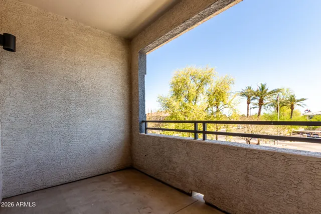 a view of a lot of a room with wooden floor and window