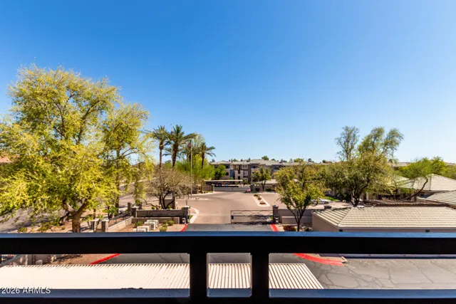 a view of swimming pool from a balcony