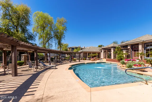 a view of a swimming pool with a lounge chair