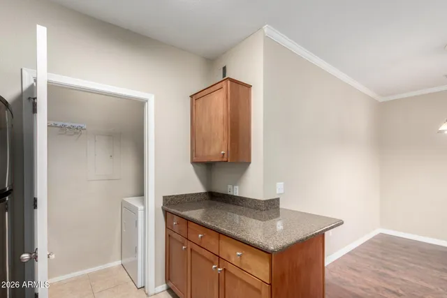 a kitchen with a wooden floor and a sink