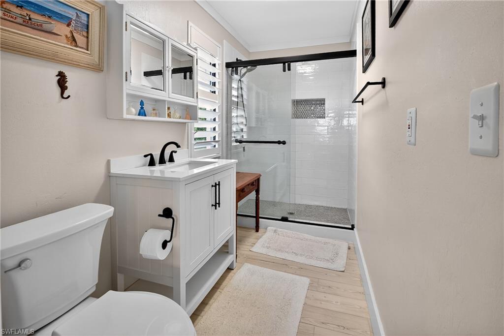 190 Tahiti Circle Naples, FL 34113 - Photo 17 of 32 a bathroom with a sink toilet and shower