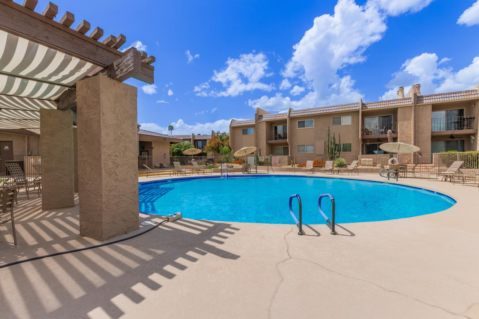 7436 East Chaparral Road, Unit B213 Scottsdale, AZ 85250 - Photo 18 of 27 a view of a swimming pool with a patio