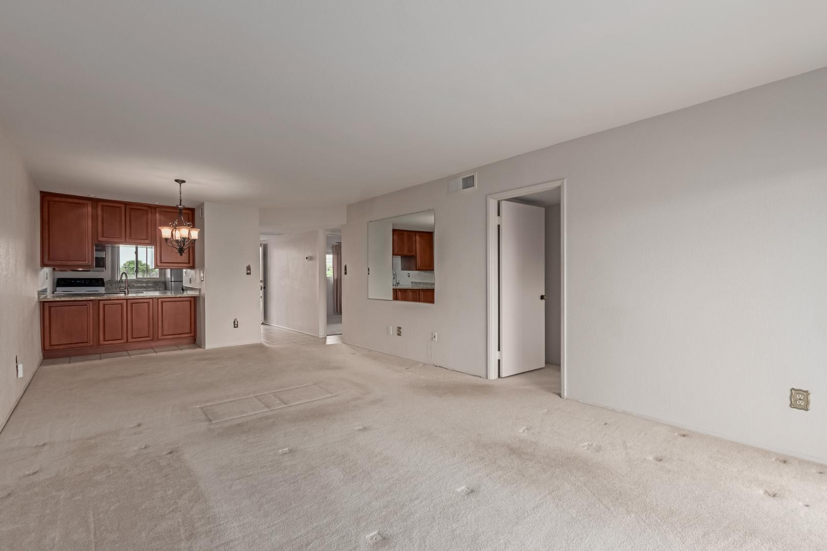 7436 East Chaparral Road, Unit B213 Scottsdale, AZ 85250 - Photo 2 of 27 a view of a kitchen with refrigerator and wooden floor