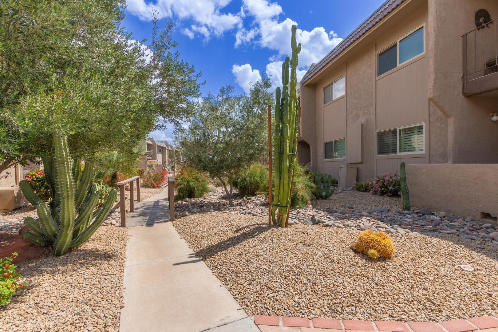 7436 East Chaparral Road, Unit B213 Scottsdale, AZ 85250 - Photo 22 of 27 a view of a backyard with table and chairs