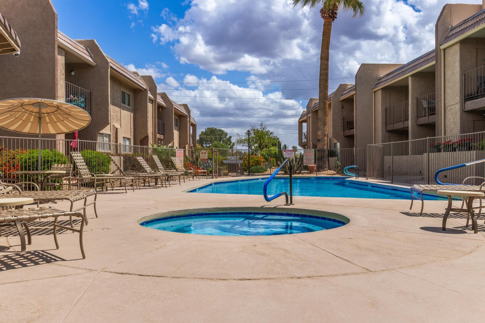 7436 East Chaparral Road, Unit B213 Scottsdale, AZ 85250 - Photo 23 of 27 a view of a house with swimming pool and sitting area