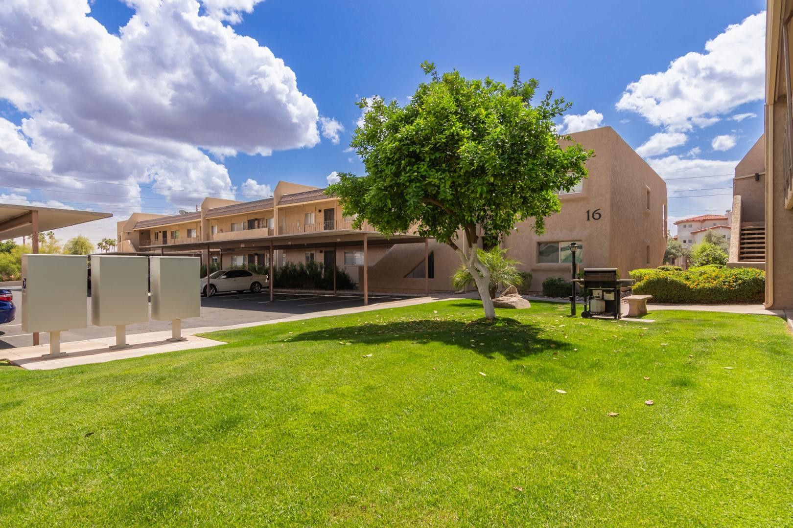 7436 East Chaparral Road, Unit B213 Scottsdale, AZ 85250 - Photo 24 of 27 a view of a house with a backyard porch and sitting area