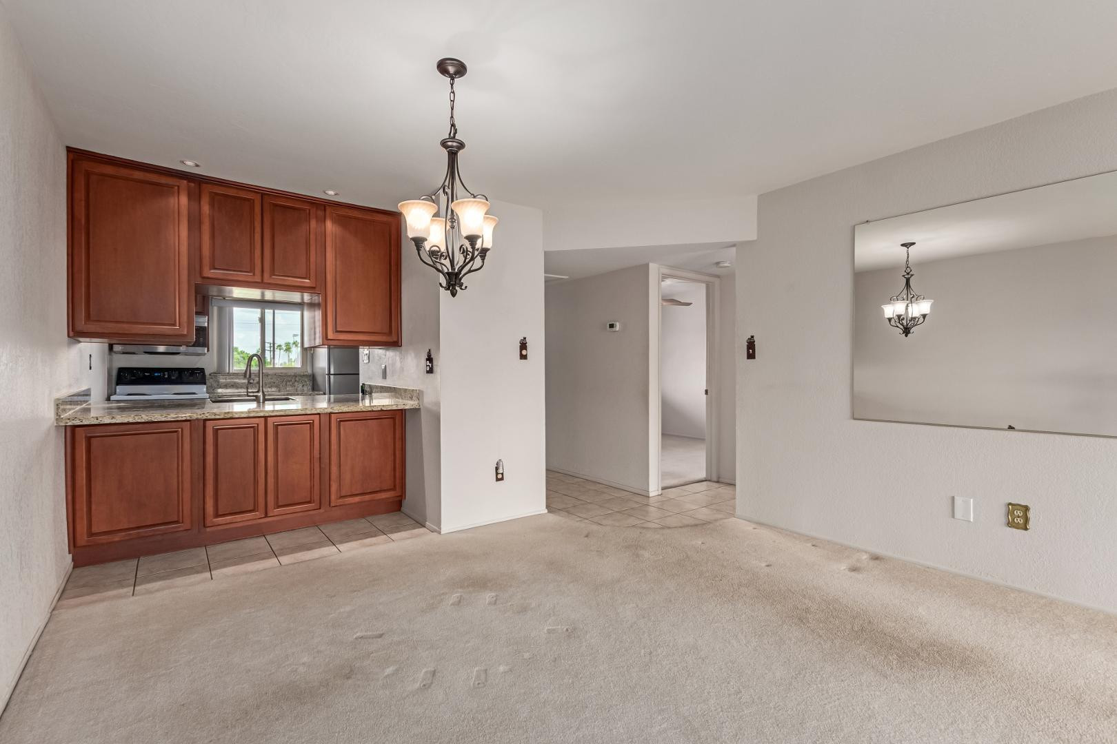 7436 East Chaparral Road, Unit B213 Scottsdale, AZ 85250 - Photo 3 of 27 a view of a kitchen with a sink and cabinets