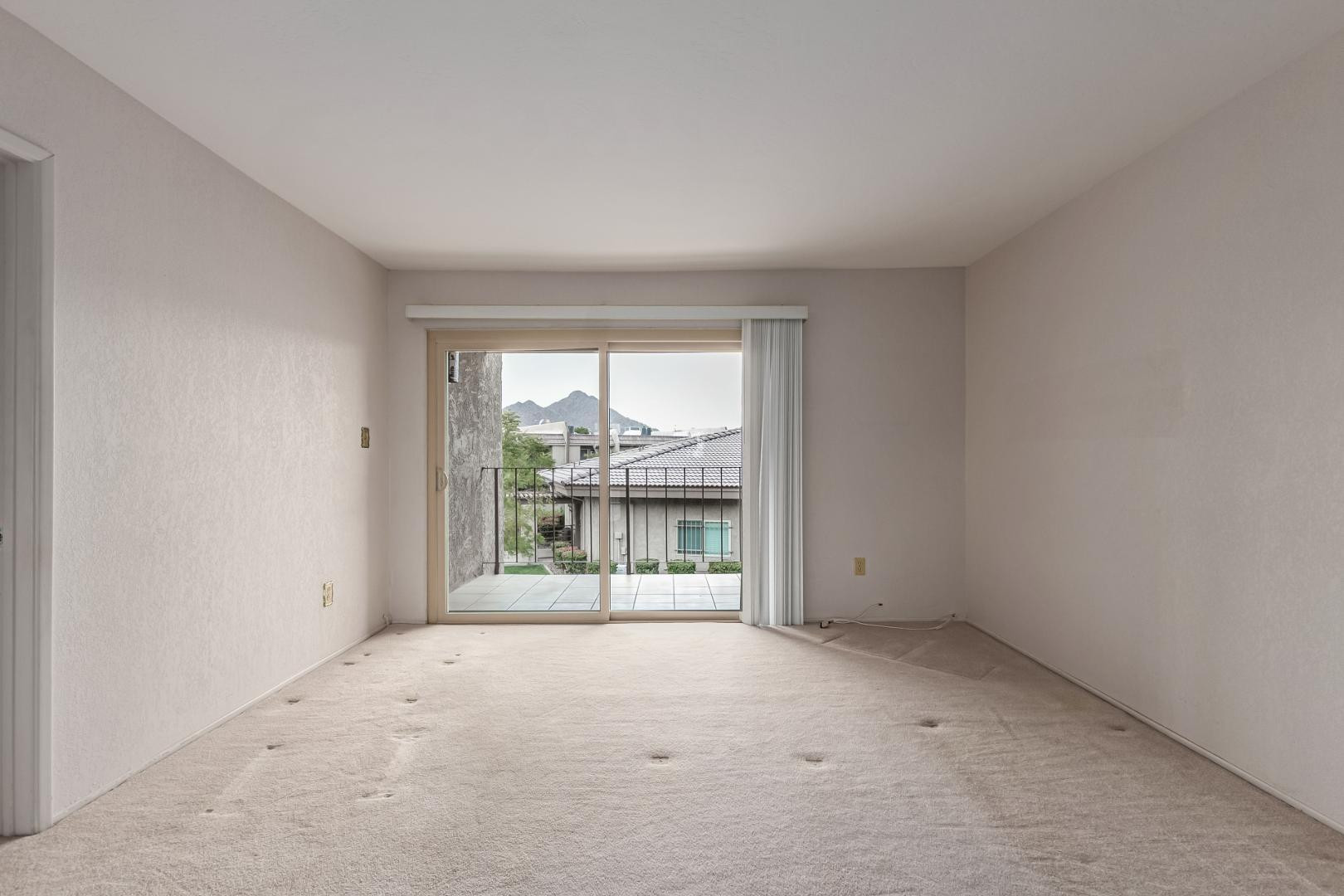 7436 East Chaparral Road, Unit B213 Scottsdale, AZ 85250 - Photo 6 of 27 an empty room with entrance door