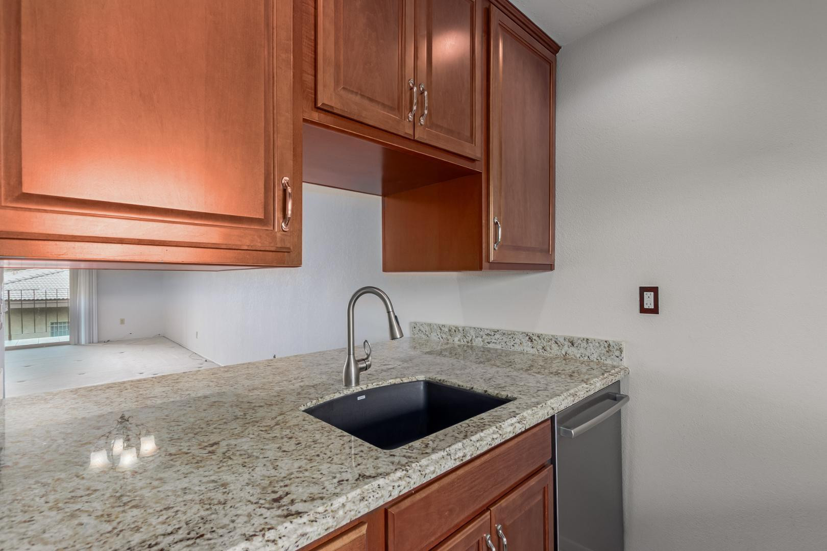 7436 East Chaparral Road, Unit B213 Scottsdale, AZ 85250 - Photo 7 of 27 a kitchen with a sink and cabinets