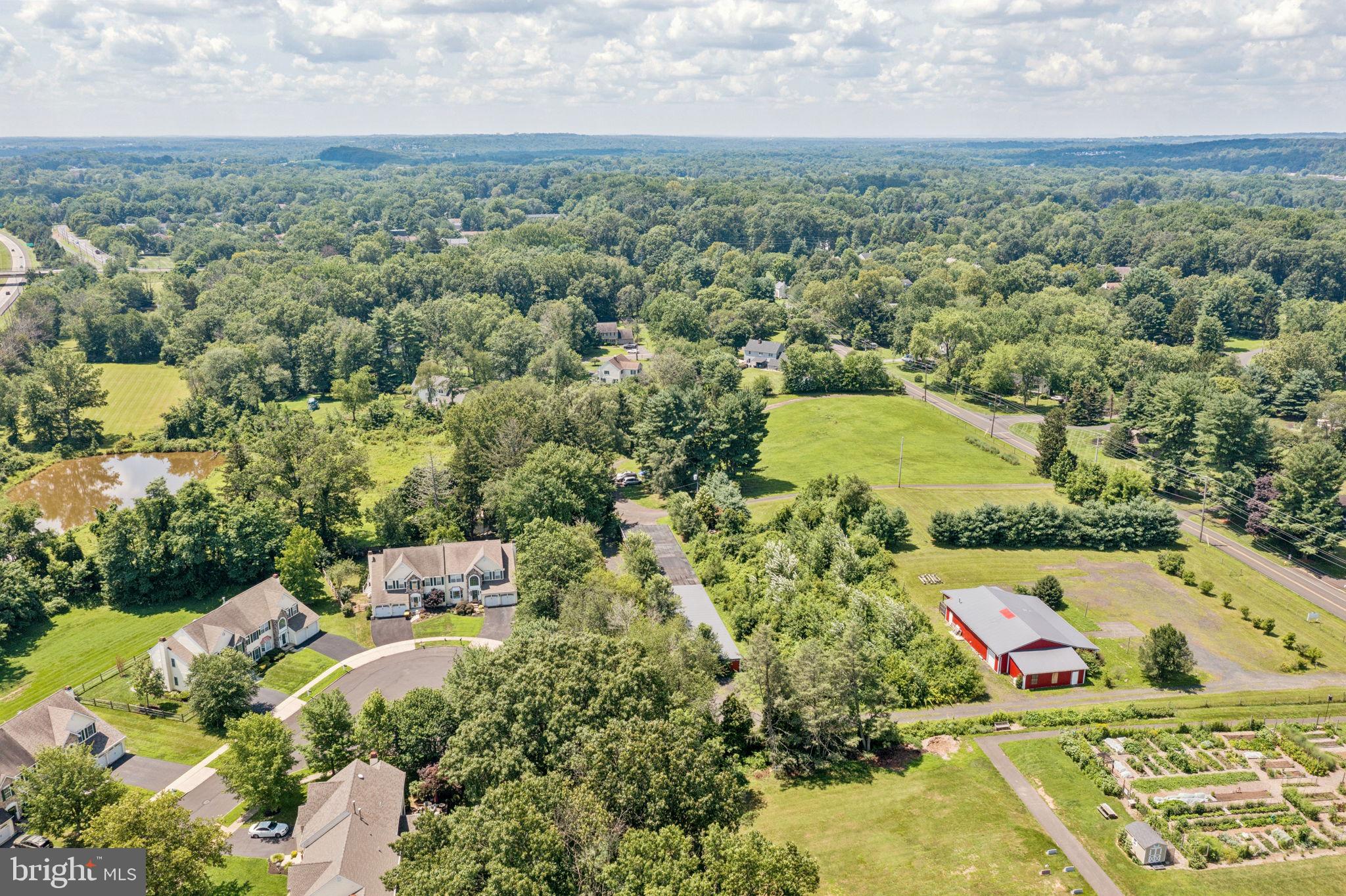 925 East Sandy Ridge Road Doylestown, PA 18901 - Photo 2 of 8 an aerial view of residential houses with outdoor space and trees