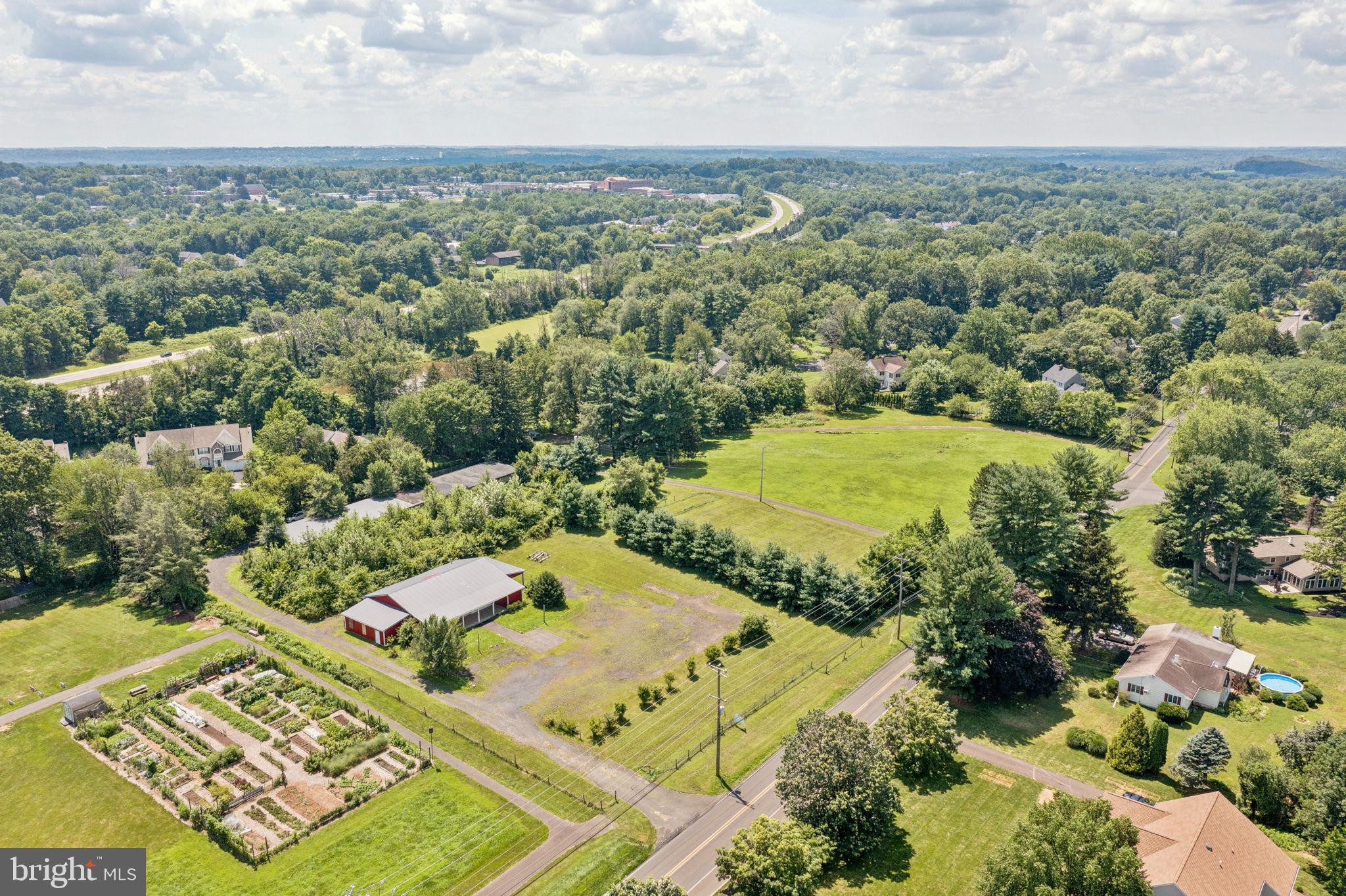 925 East Sandy Ridge Road Doylestown, PA 18901 - Photo 4 of 8 an aerial view of a residential houses with outdoor space