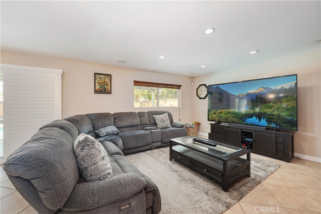 2203 Homewood Avenue Simi Valley, CA 93063 - Photo 10 of 37 a living room with furniture and a flat screen tv