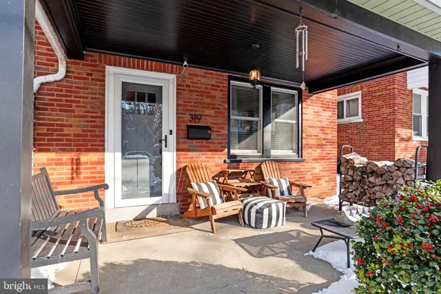 a view of a patio with table and chairs and potted plants